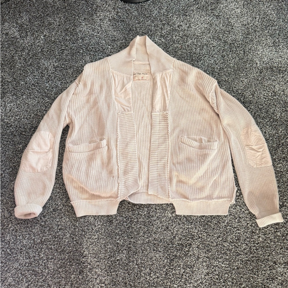 We the Free cardigan in a creamy color.